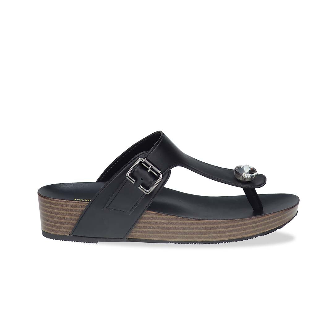 Side view of Thomas Chan’s Dazzle Crystal Adjustable Flip-Flops in black, featuring a sparkling crystal stone, adjustable buckle strap, and LiteStep flatform footbed, highlighting their casual yet elegant style.