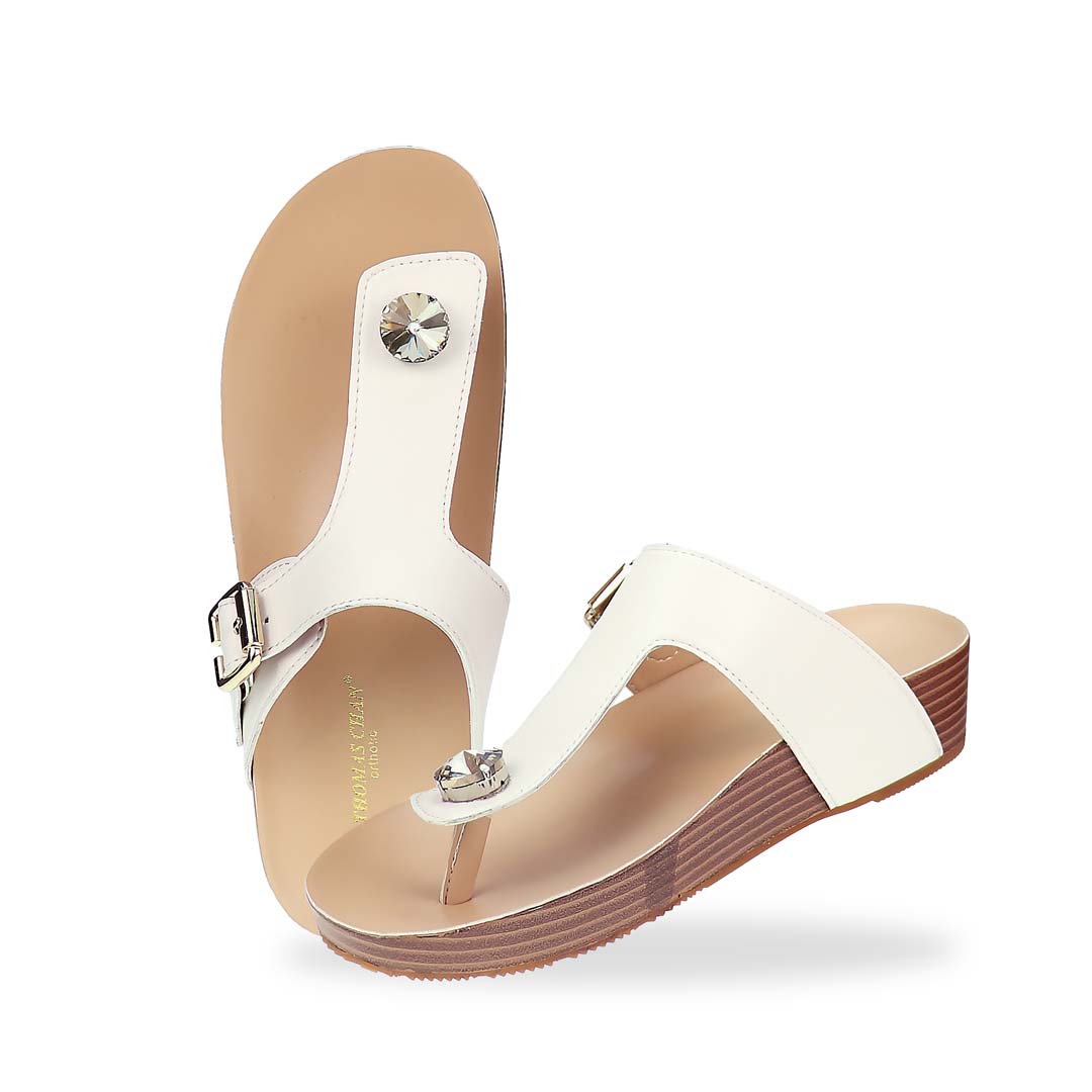 Full view of Thomas Chan’s Dazzle Crystal Adjustable Flip-Flops in ivory, featuring a sparkling crystal stone, adjustable buckle strap, and LiteStep flatform footbed, highlighting their casual yet elegant style.