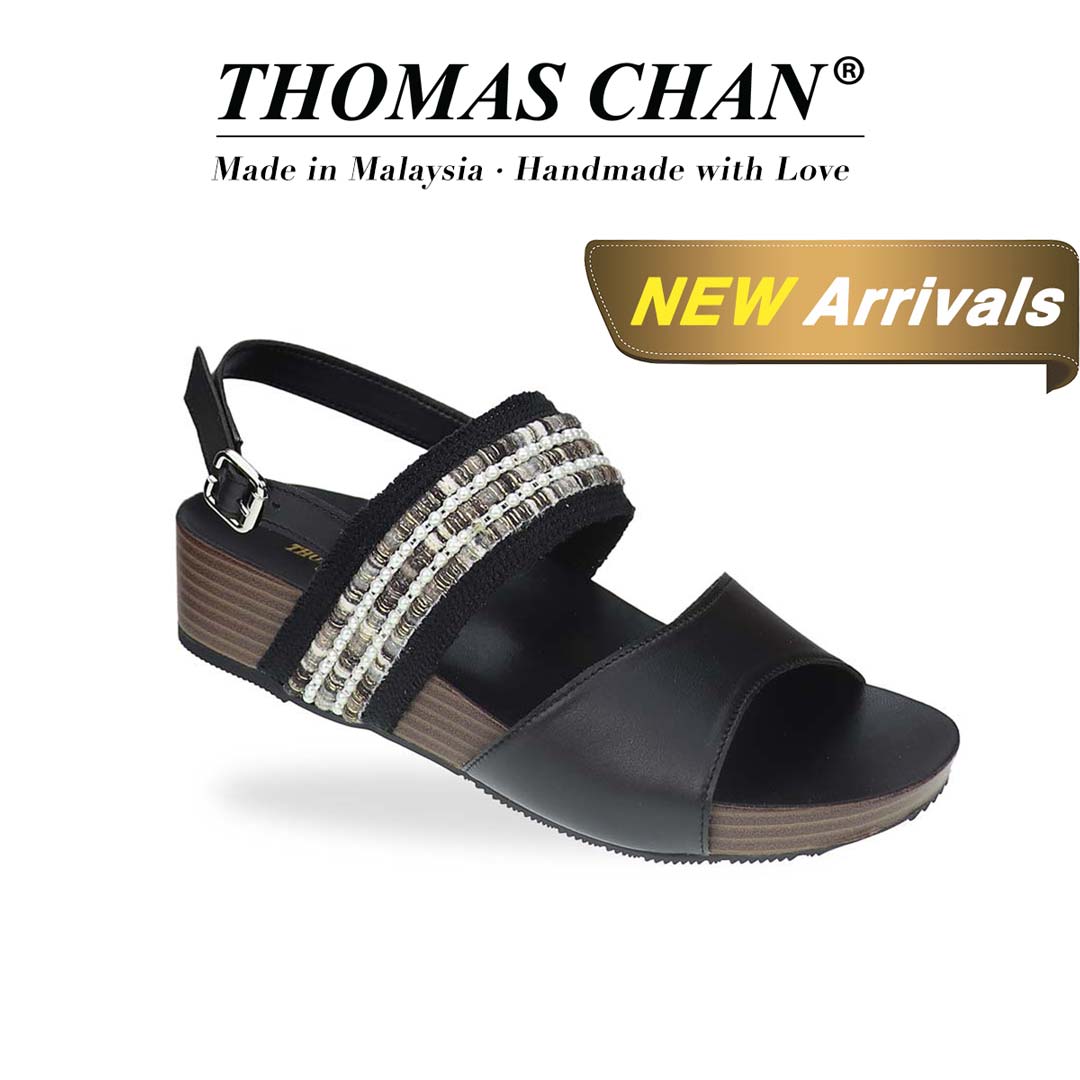 Diagonal view of Thomas Chan’s Summer Love Duo-Strap Slingback Sandals in black, showcasing elegant duo straps, a secure slingback design, and a LiteStep flatform sole with light arch support, emphasising their casual yet sophisticated style.The 'THOMAS CHAN®' brand logo is clearly visible, with the inscription 'Made in Malaysia · Handmade with Love' underneath. A gold and white banner showcases the special offer: 'New Arrival.'