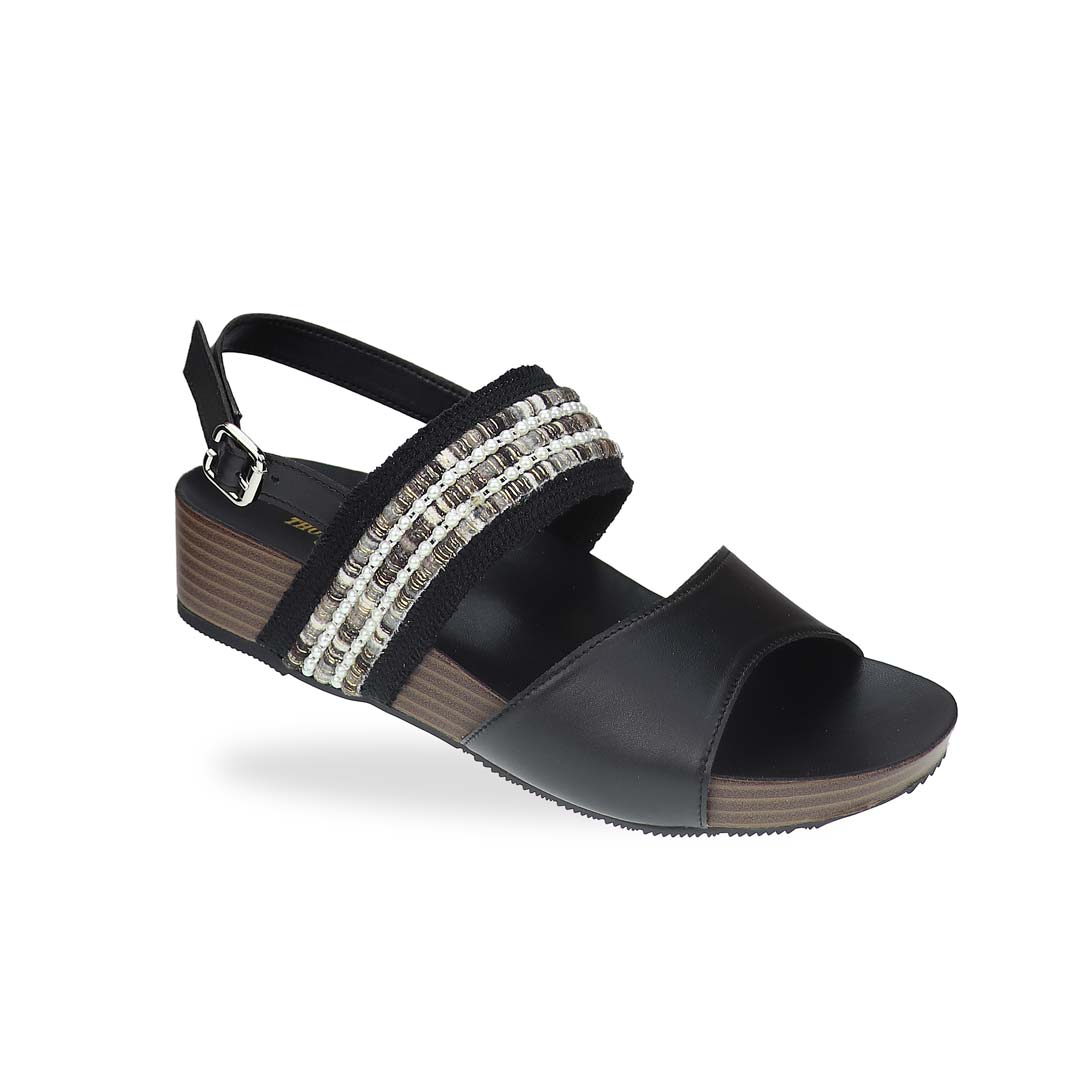 Diagonal view of Thomas Chan’s Summer Love Duo-Strap Slingback Sandals in black, featuring elegant duo straps, a secure slingback design, and a LiteStep flatform sole with light arch support, highlighting their casual yet sophisticated style.