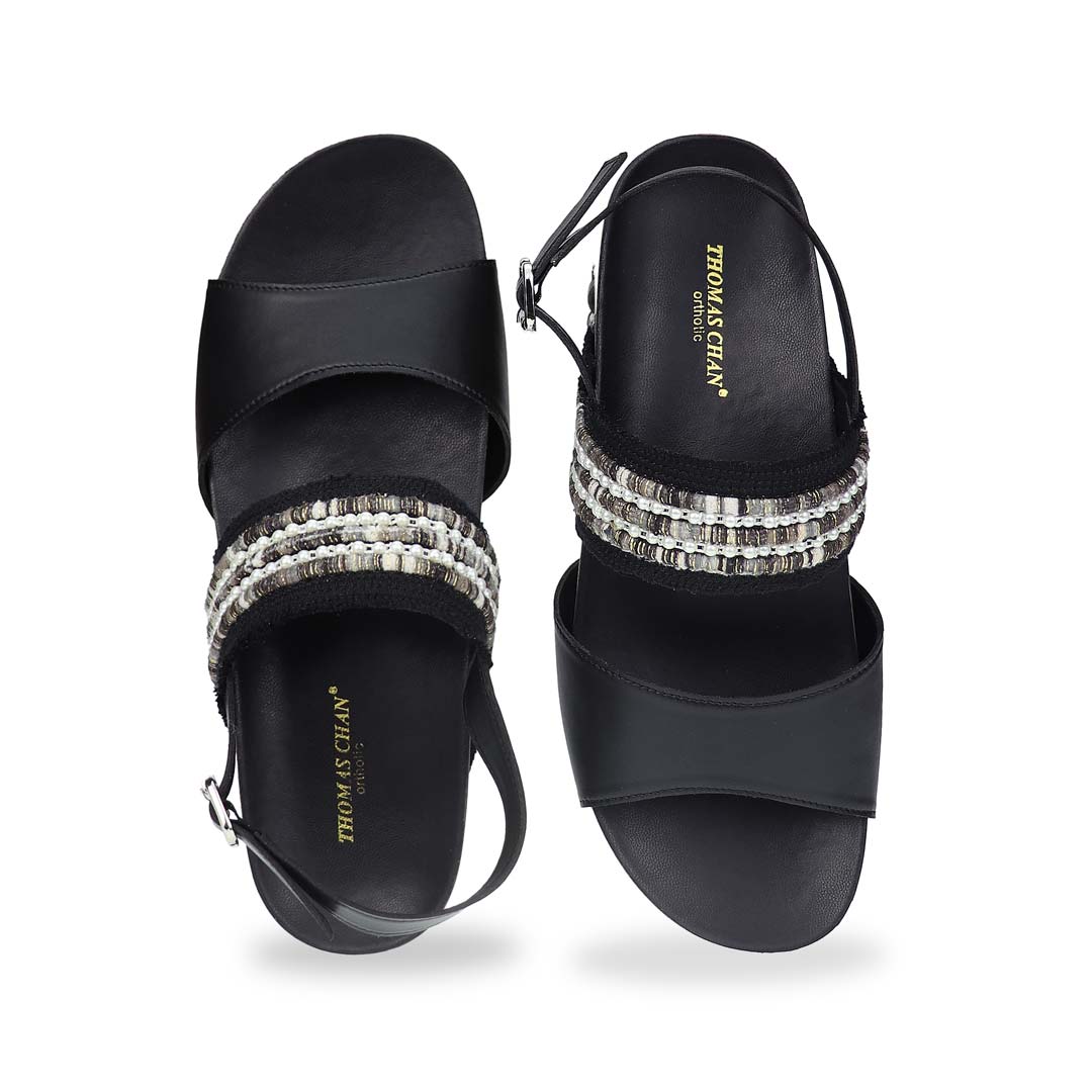 Front view of Thomas Chan’s Summer Love Duo-Strap Slingback Sandals in black, featuring elegant duo straps, a secure slingback design, and a LiteStep flatform sole with light arch support, highlighting their casual yet sophisticated style.