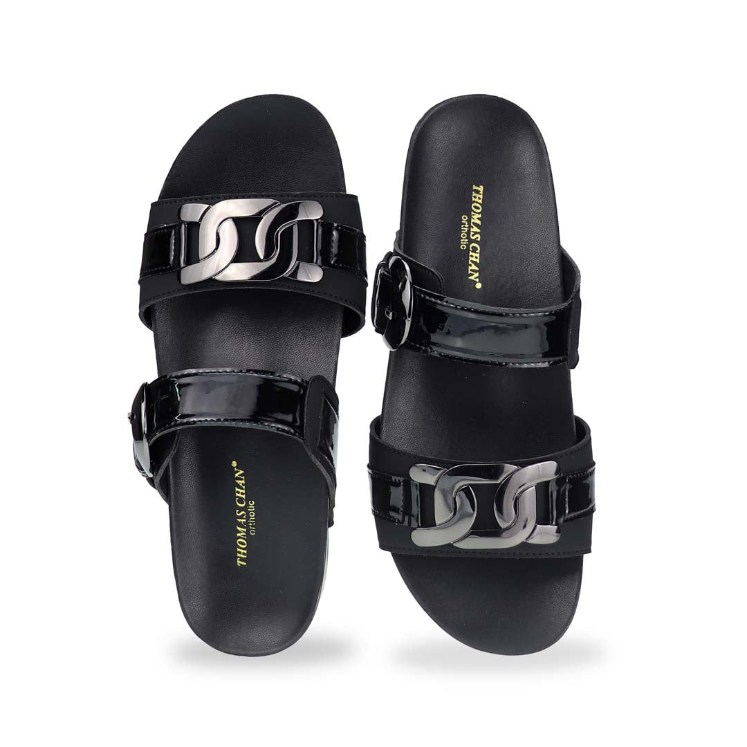 Front view of Thomas Chan’s Metallic Duo-Strap Adjustable Sandals in black, showcasing sleek metallic straps, an adjustable buckle for a perfect fit, and a LiteStep flatform footbed for added comfort.