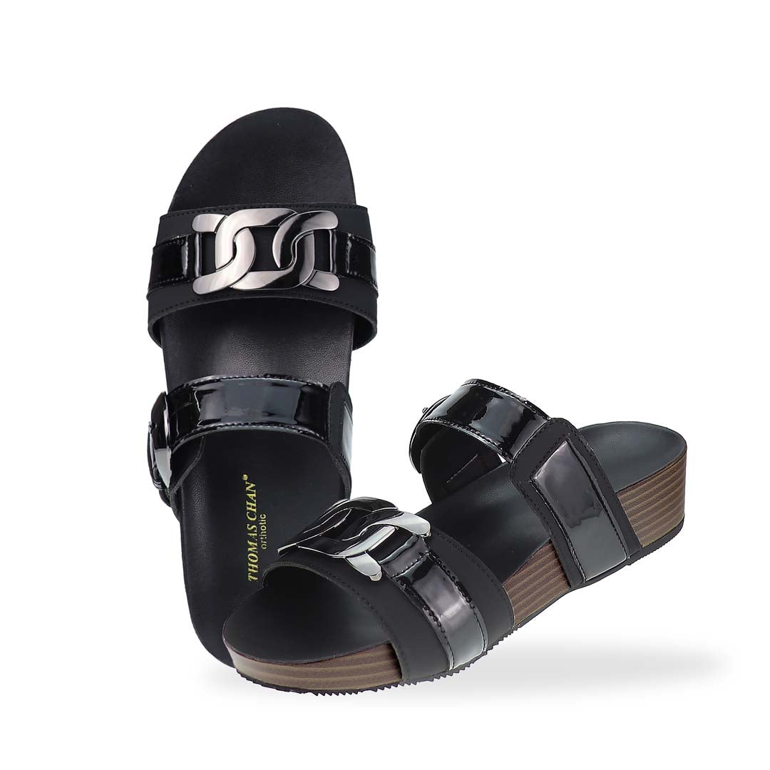 Full view of Thomas Chan’s Metallic Duo-Strap Adjustable Sandals in black, showcasing sleek metallic straps, an adjustable buckle for a perfect fit, and a LiteStep flatform footbed for added comfort.