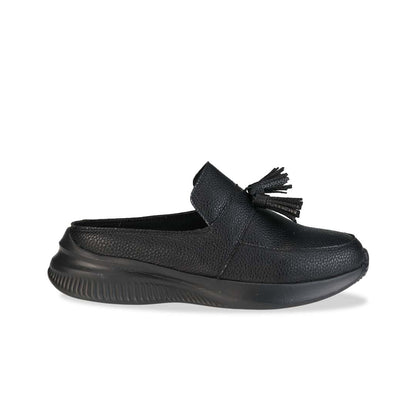 Side view of Thomas Chan Feather-Light Tassel Slide-On Loafers in black, featuring a tassel bell design and a comfortable cushioned footbed.