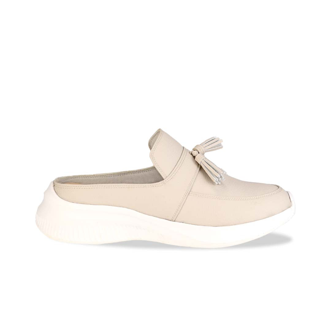 Side view of Thomas Chan Feather-Light Tassel Slide-On Loafers in ivory, featuring a tassel bell design and a comfortable cushioned footbed.