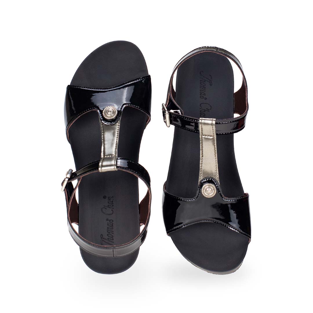 Front view of Thomas Chan black and silver T-strap design with colour-matching detail comfortable wedge sandal shoe.