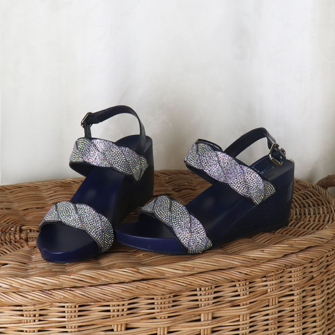 Vibrant blue high-heeled wedge sandals designed by Thomas Chan. These sandals feature intricate diamond braiding, a chic slingback design with a buckle, and are suitable for both dinner and occasion wear.