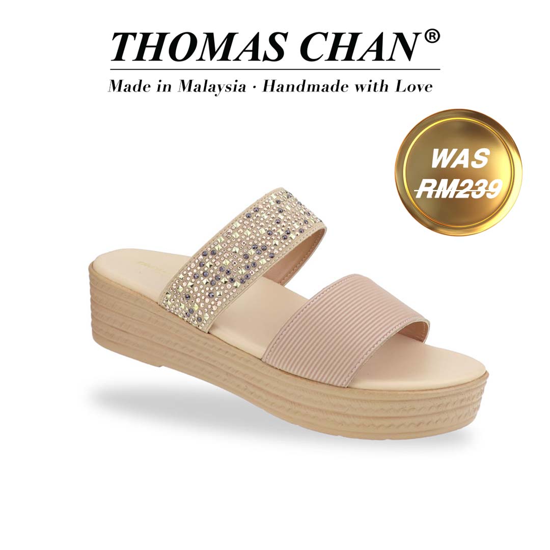 Diagonal view of Thomas Chan boho rhinestone flatform sandals in cream, featuring a comfort cushioned footbed. 'THOMAS CHAN®' brand displayed with 'Made in Malaysia · Handmade with Love' below. A gold and white banner highlights a special offer: 'Was RM239"