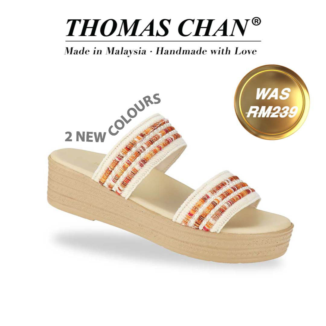 Thomas Chan Summer Love Boho low platform sandals in orange and white embroidery, featuring a comfort footbed. 'THOMAS CHAN®' brand displayed with 'Made in Malaysia · Handmade with Love' below. A gold and white banner highlights a special offer: 'Was RM239"