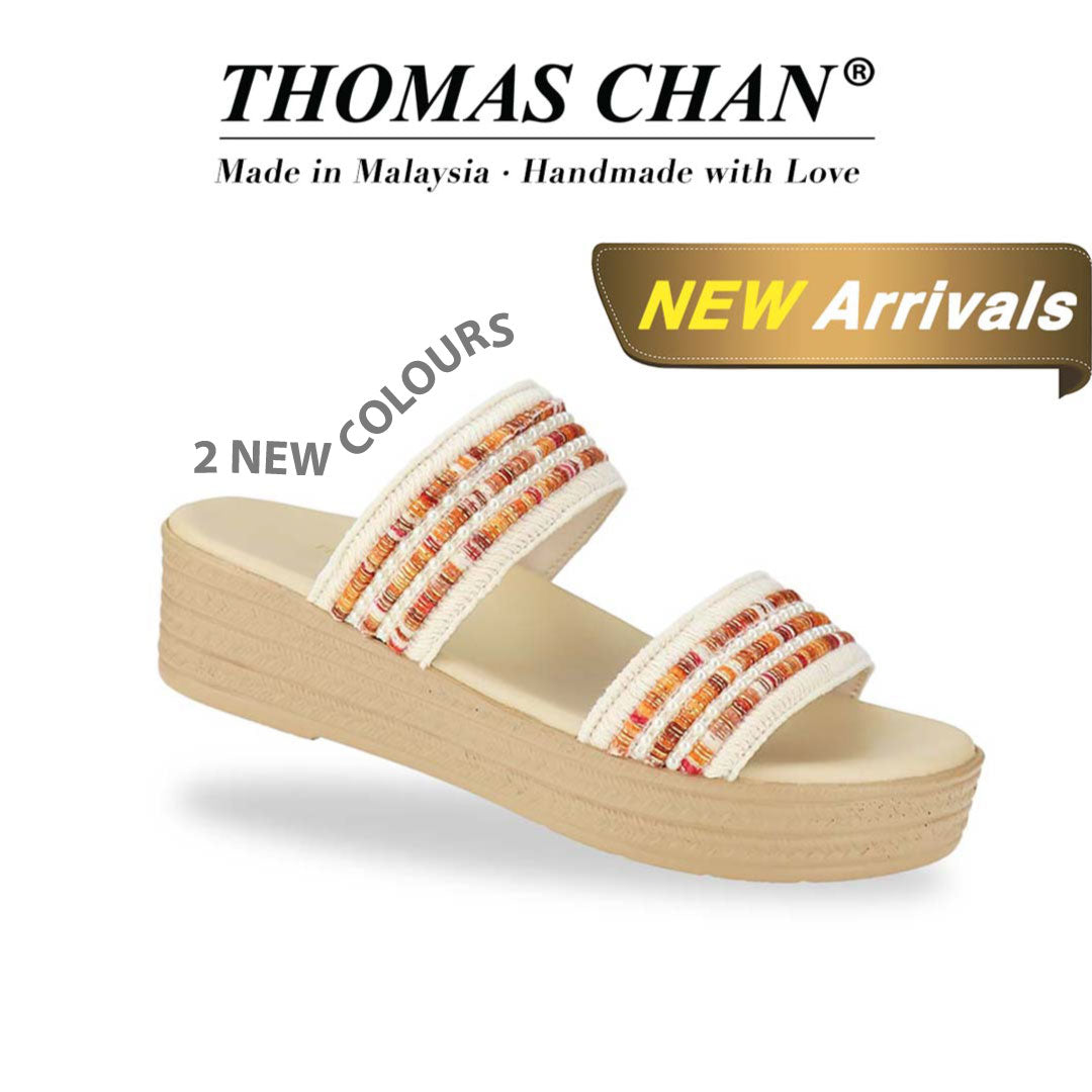 Thomas Chan Summer Love Boho low platform sandals in orange and white embroidery, featuring a comfort footbed. 'THOMAS CHAN®' brand displayed with 'Made in Malaysia · Handmade with Love' below. A gold and white banner highlights a special offer: 'New Arrival'