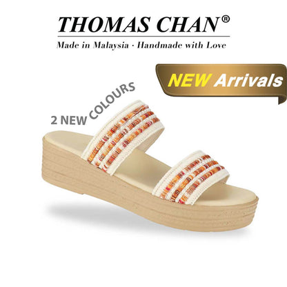 Thomas Chan Summer Love Boho low platform sandals in orange and white embroidery, featuring a comfort footbed. 'THOMAS CHAN®' brand displayed with 'Made in Malaysia · Handmade with Love' below. A gold and white banner highlights a special offer: 'New Arrival'