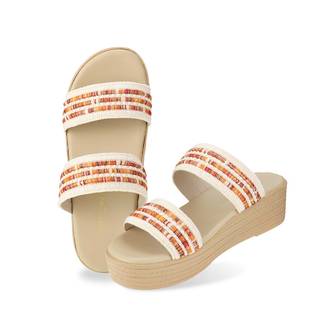 Full view of Thomas Chan Summer Love Boho low platform sandals in orange and white embroidery, featuring a comfort footbed. The platform, with a light brown braided element, measures 3cm at the front and 5cm at the back.