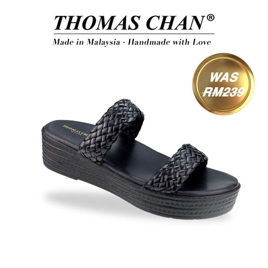 Diagonal view of Thomas Chan Braided Strap Flatform Sandals in black, featuring a comfort cushioned footbed. 'THOMAS CHAN®' brand displayed with 'Made in Malaysia · Handmade with Love' below. A gold and white banner highlights a special offer: 'Was RM239"