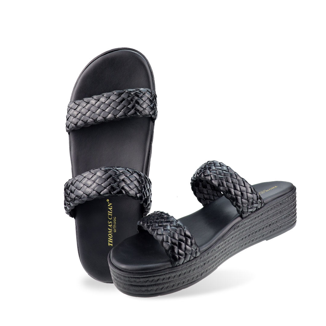 Full view of Thomas Chan Braided Strap Flatform Sandals in black, featuring a comfort cushioned footbed.  The platform, with a black braided element, measures 3cm at the front and 5cm at the back.