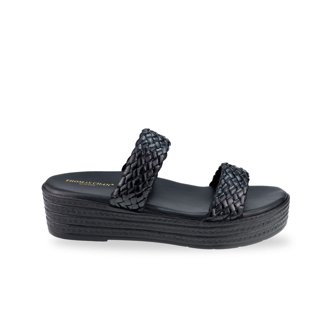 Side view of Thomas Chan Braided Strap Flatform Sandals in black, featuring a comfort cushioned footbed.  The platform, with a black braided element, measures 3cm at the front and 5cm at the back.