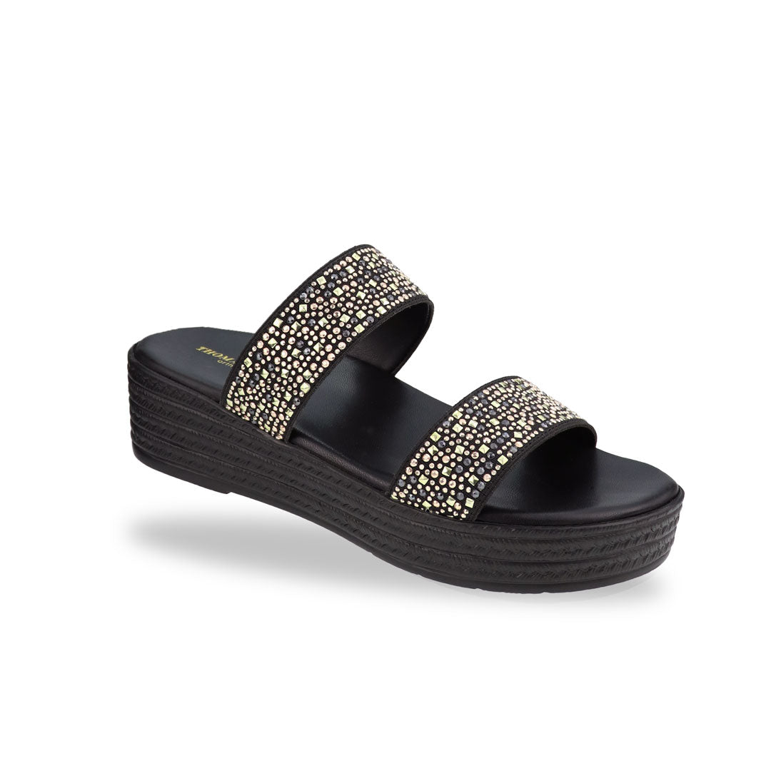 Diagonal view of the Thomas Chan Strappy Rhinestone Flatform Sandals in black, featuring two elegant rhinestone-adorned straps and a cushioned footbed designed for maximum comfort. The platform, with a black braided element, measures 3cm at the front and 5cm at the back.