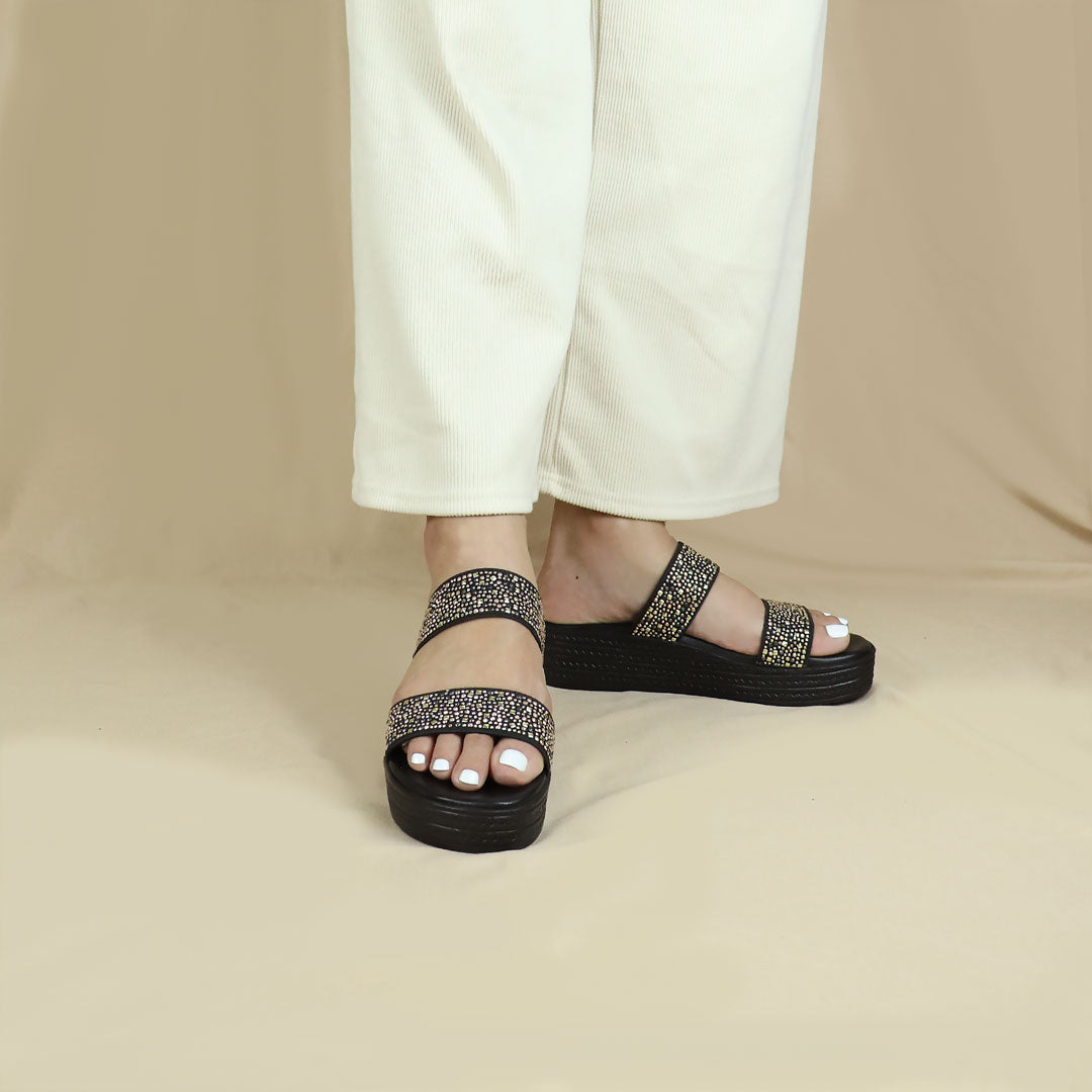 Model wearing size 37  Thomas Chan Strappy Rhinestone Flatform Sandals in black from the standing front view, featuring a comfort footbed. The platform, with a light brown braided element, measures 3cm at the front and 5cm at the back.