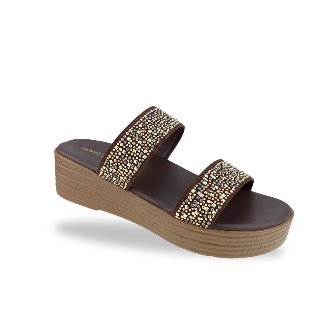 Diagonal view of the Thomas Chan Strappy Rhinestone Flatform Sandals in brown, featuring two elegant rhinestone-adorned straps and a cushioned footbed designed for maximum comfort. The platform, with a light brown braided element, measures 3cm at the front and 5cm at the back.