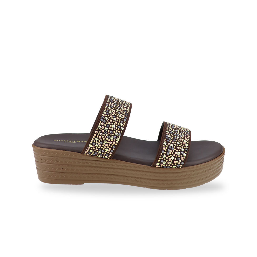 Side view of the Thomas Chan Strappy Rhinestone Flatform Sandals in brown, featuring two elegant rhinestone-adorned straps and a cushioned footbed designed for maximum comfort. The platform, with a light brown braided element, measures 3cm at the front and 5cm at the back.