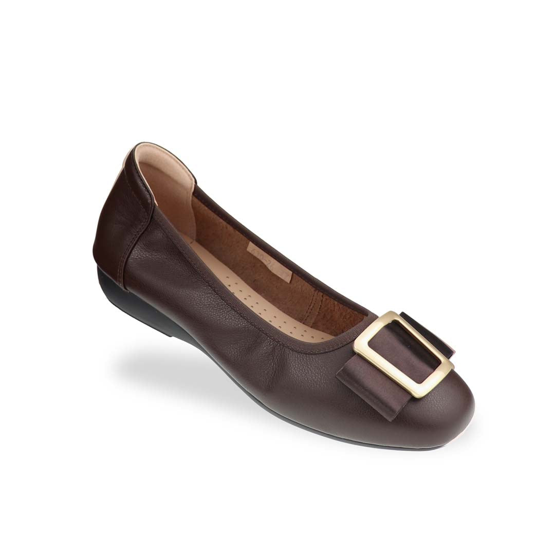  A close-up diagonal view of Thomas Chan's Soft Calf Leather Ribbon Ballet Pumps in dark brown, showcasing the smooth calf leather, ribbon buckle detail, and delicate elastic trim.