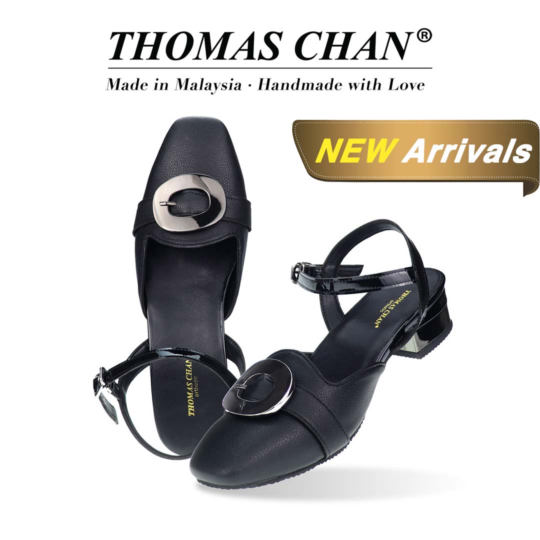 Diagonal view of Thomas Chan's online exclusive Square Toe Ankle Strap Low Heels in sleek black. Featuring a convenient hook-and-loop buckle for easy wear, these heels are designed to provide all-day comfort while adding a touch of elegance to your look. The 'THOMAS CHAN®' brand logo is clearly visible, with the inscription 'Made in Malaysia · Handmade with Love' underneath. A gold and white banner showcases the special offer"NEW ARRIVAL"