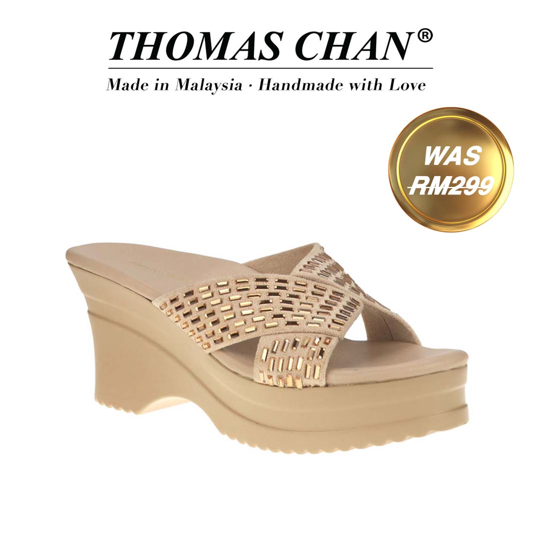 Thomas Chan's Diamond Crisscross Cushioned Heels in gold, featuring an elegant design and comfortable cushioned footbed. "THOMAS CHAN®" brand displayed with "Made in Malaysia · Handmade with Love" below. Gold and white banner highlights special offer: "WAS 299."