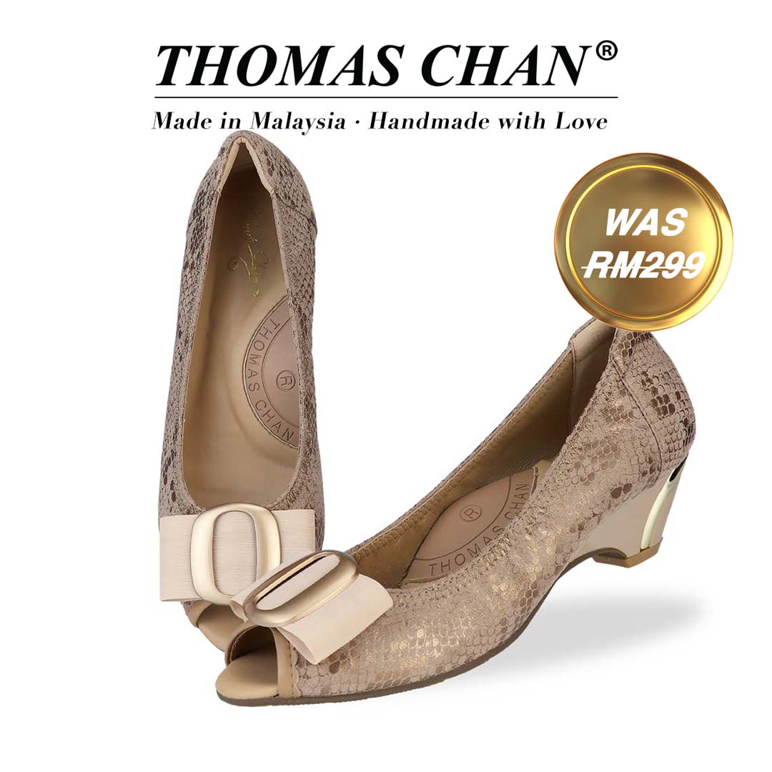 Thomas Chan's Vintage Print Pumps with Ribbon Buckle in apricot, featuring an elegant design and arch-support footbed. The "THOMAS CHAN®" brand is displayed with "Made in Malaysia · Handmade with Love" below. A gold and white banner highlights a special offer: "Was 299."