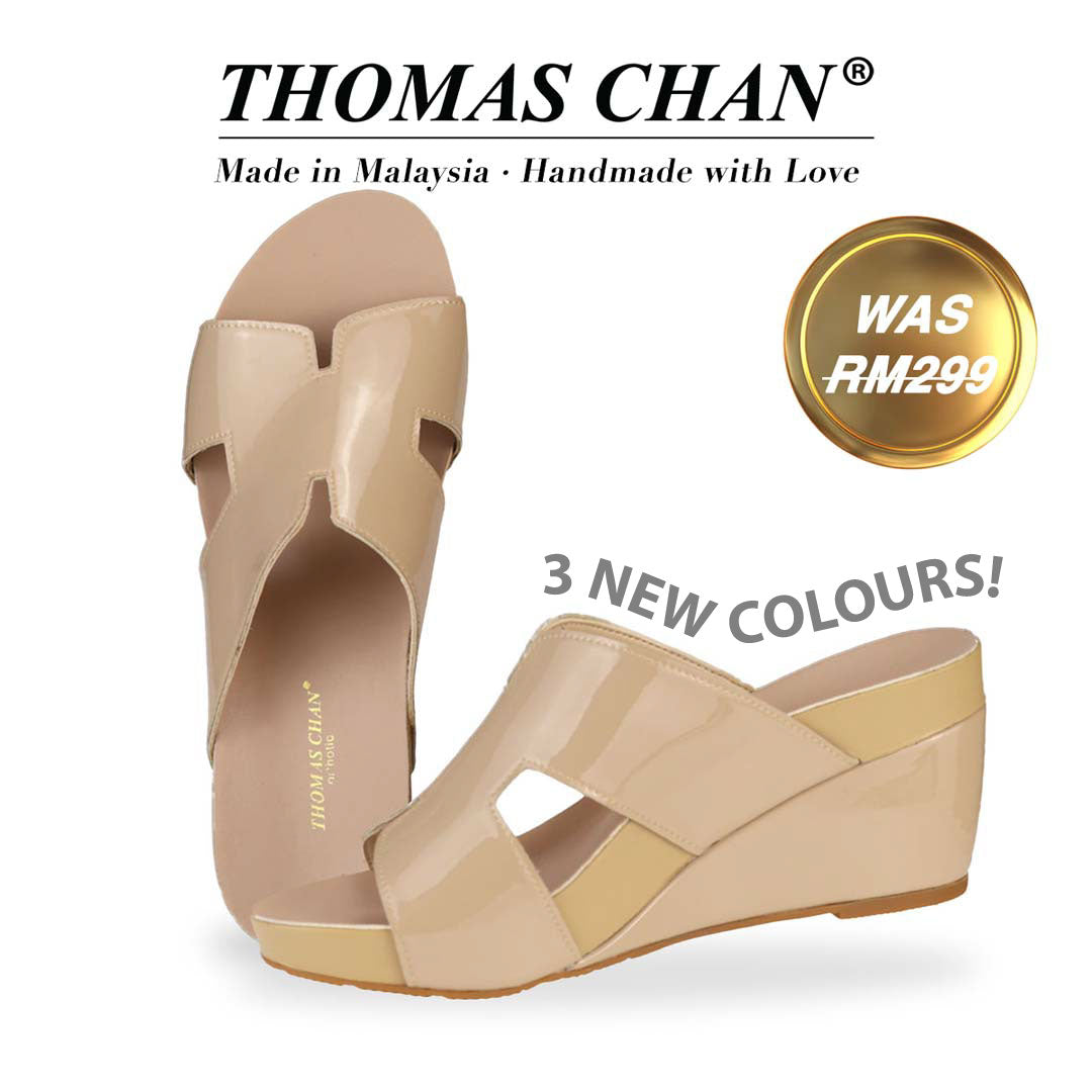  Introducing Thomas Chan H-Strap Wedge Sandals in Light Cream, featuring an elegant H-strap design and a built-in arch-support footbed. "3 NEW COLOURS!" is highlighted around the shoe. The "THOMAS CHAN®" brand is displayed with "Made in Malaysia · Handmade with Love" below. A gold and white banner highlights a special offer: "WAS 299."