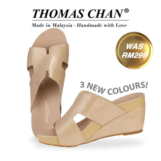  Introducing Thomas Chan H-Strap Wedge Sandals in Light Cream, featuring an elegant H-strap design and a built-in arch-support footbed. "3 NEW COLOURS!" is highlighted around the shoe. The "THOMAS CHAN®" brand is displayed with "Made in Malaysia · Handmade with Love" below. A gold and white banner highlights a special offer: "WAS 299."