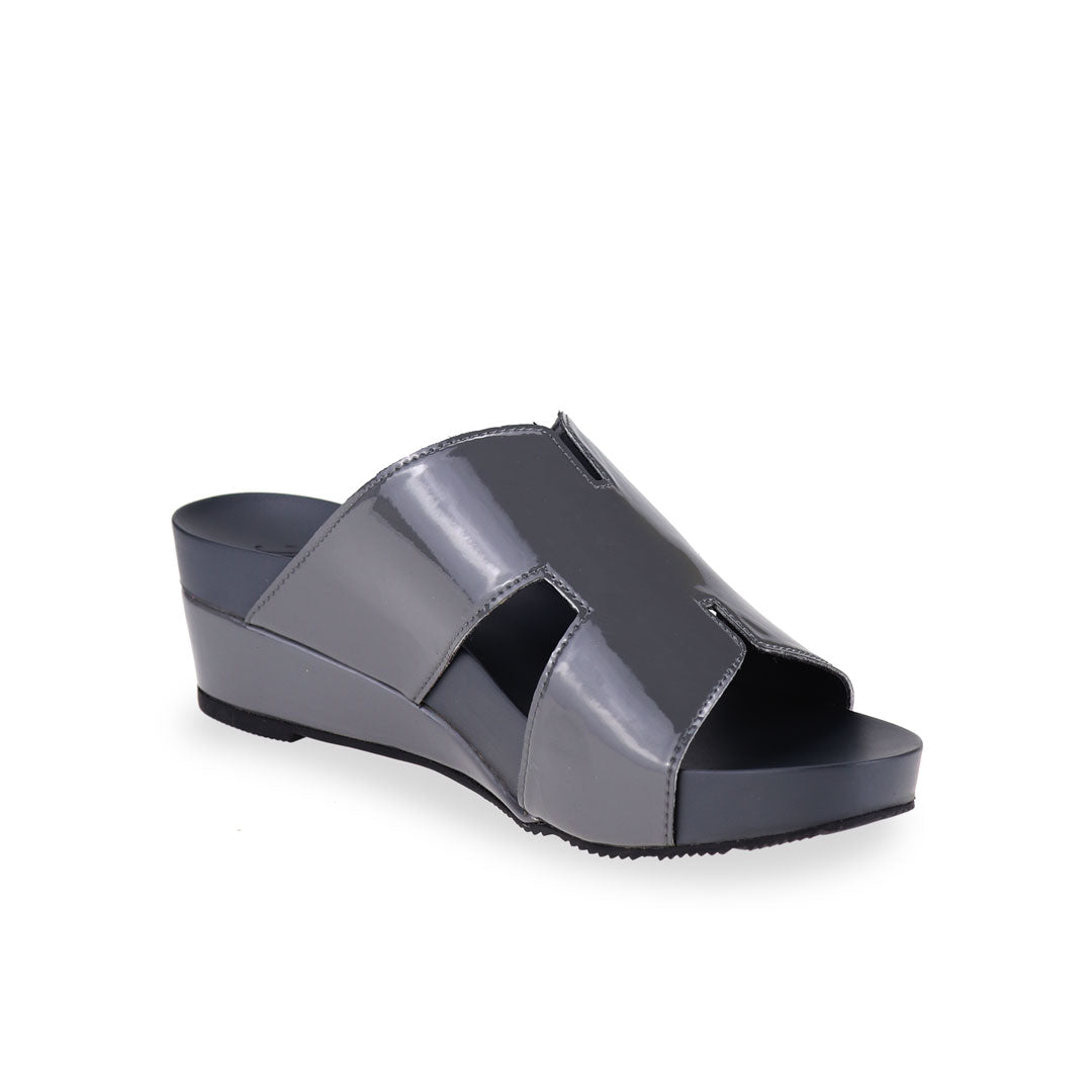 Diagonal view of Thomas Chan silverish grey colour comfortable H-strap low wedge slide sandals with arch support