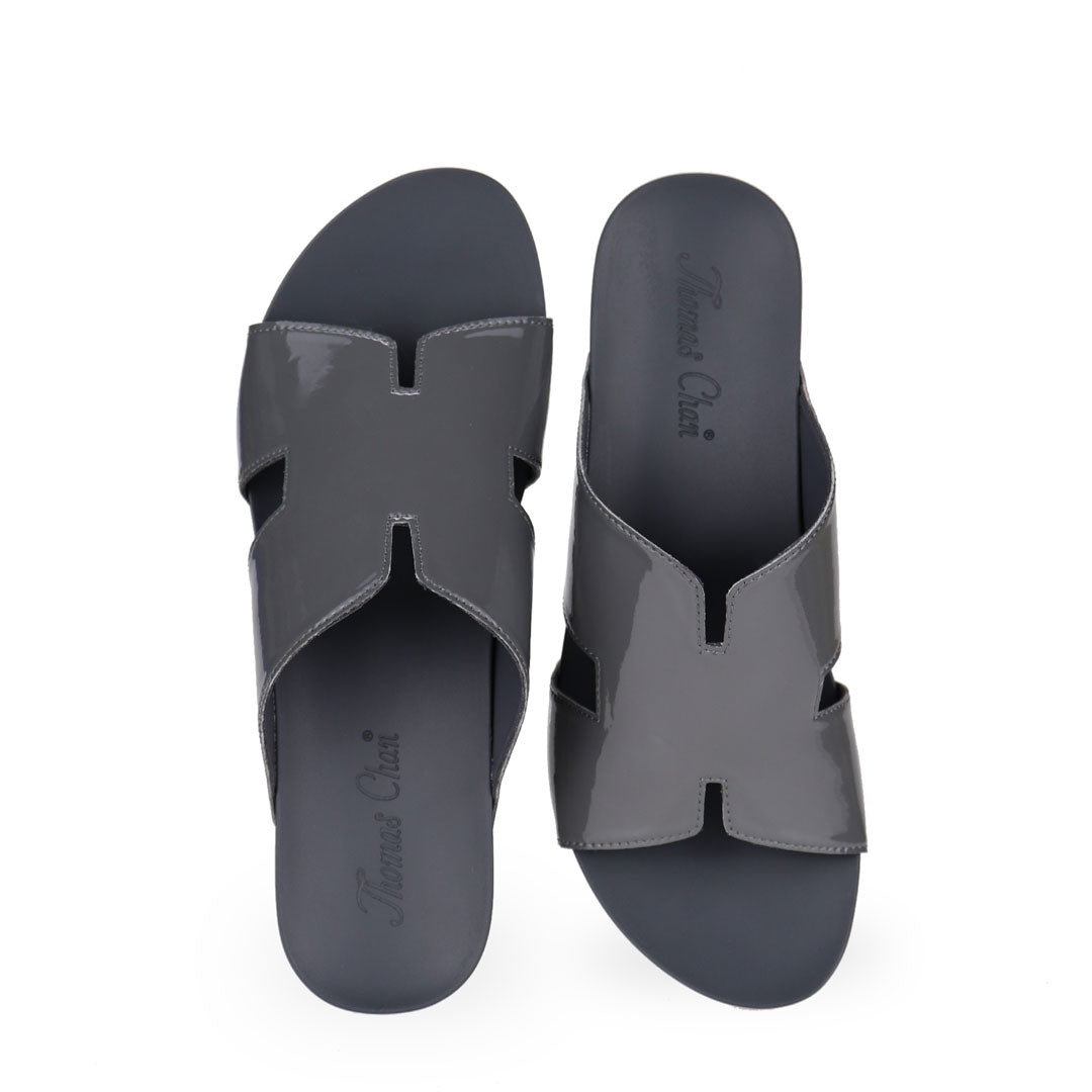 front view of Thomas Chan silverish grey colour comfortable H-strap low wedge slide sandals with arch support