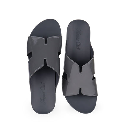 front view of Thomas Chan silverish grey colour comfortable H-strap low wedge slide sandals with arch support