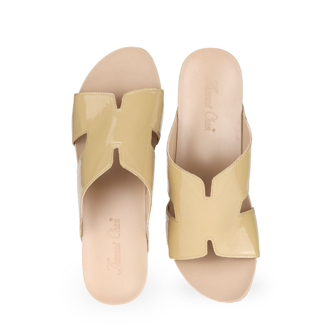 Front view of Thomas Chan pastel yellow color comfortable H-strap low wedge slide sandals with arch support