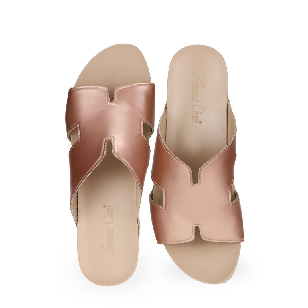 Front view of Thomas Chan rose gold colour comfortable H-strap low wedge slide sandals with arch support