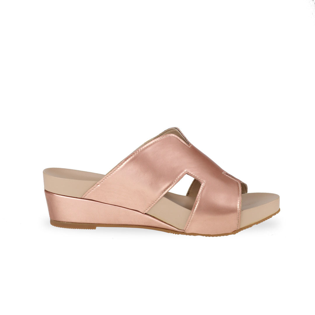 Side view of Thomas Chan rose gold colour comfortable H-strap low wedge slide sandals with arch support