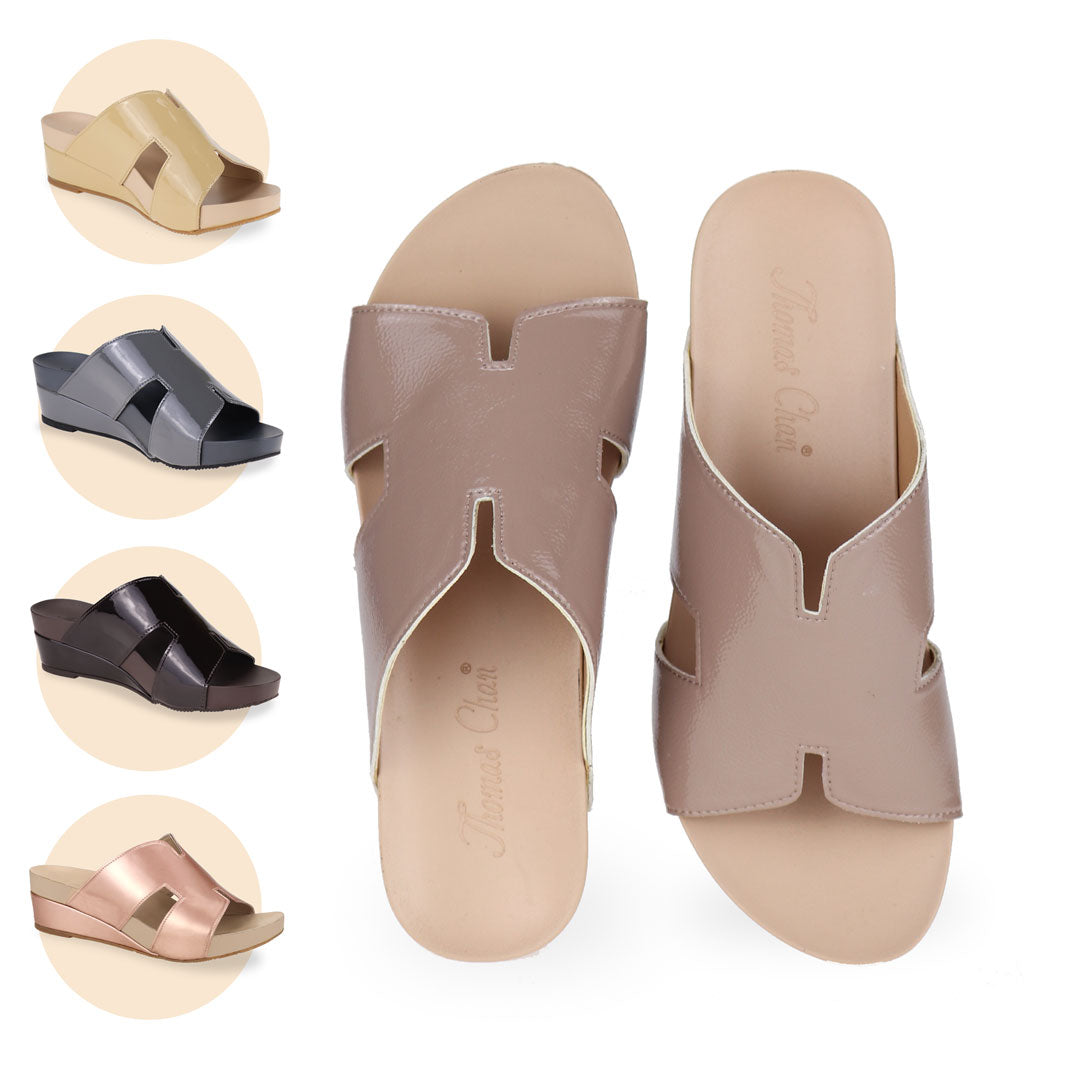  Introducing Thomas Chan comfortable H-strap low wedge slide sandals, featuring built-in arch-support insoles for enhanced comfort and ease of walking. Available in light taupe, pale yellow, silver grey, dark brown, and rose gold colours. 