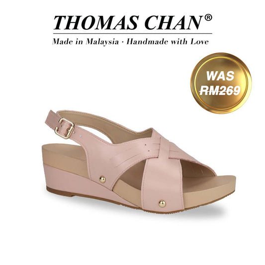 Thomas Chan Cross Strap Slingback Low Wedge Sandals in pink, featuring an elegant slingback design and arch-support footbed. "THOMAS CHAN®" brand displayed with "Made in Malaysia · Handmade with Love" below. Gold and white banner highlights special offer: "WAS 269."