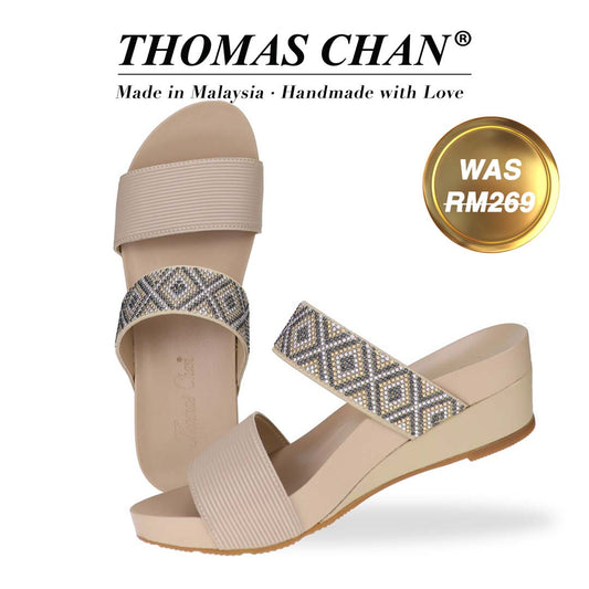 Thomas Chan Strappy Boho Slide Sandals in sandy beige, showcasing an arch-support footbed. "THOMAS CHAN®" brand displayed with "Made in Malaysia · Handmade with Love" below. Gold and white banner highlights special offer: "WAS 269."