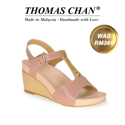 Thomas Chan T-Strap Slingback Wedges in pink & gold, combining style and comfort. The sandal showcases a T-strap design embellished with metallic studs and a 3-inch wedge heel. Designed with built-in arch-support footbed technology for enduring comfort. A gold badge displays the original price of RM369, with accompanying text above celebrating "THOMAS CHAN® Made in Malaysia · Handmade with Love."