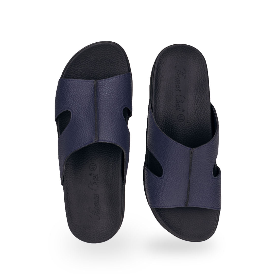 Front view of Thomas Chan blue flip flop leather orthotic sandals for men featuring a simple cutout breathable design, featuring soft arch-support footbed