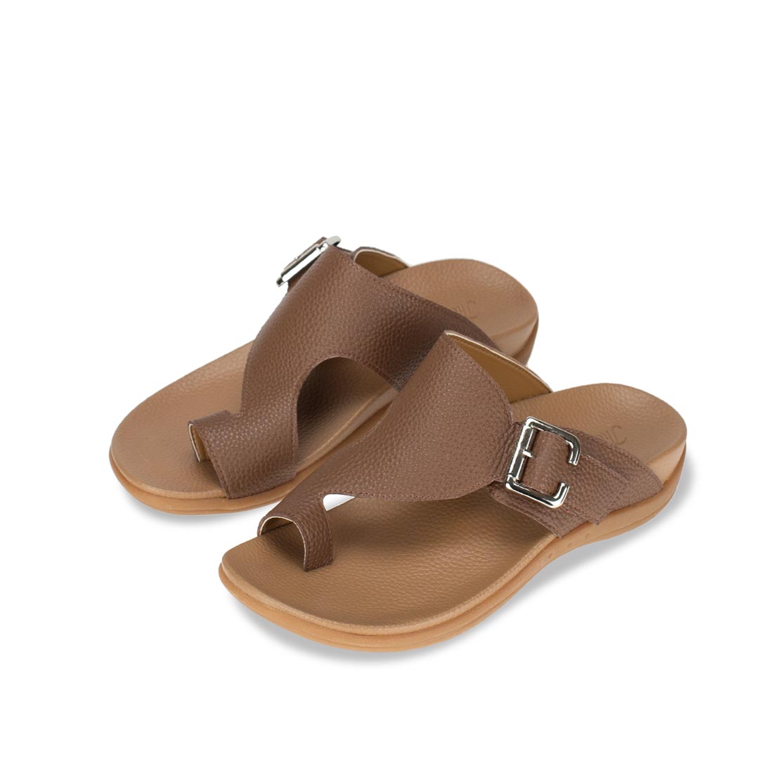 Diagonal view of Thomas Chan Toe Loop Sandals with buckle in light brown colour, featuring a simple and easy matching style with arch support footbed.