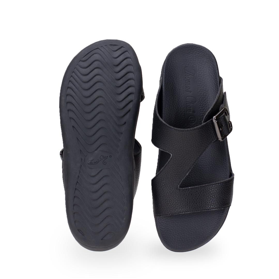 Back view of comfortable men's black leather sandals with orthotic arch support footbed, featuring a special zig-zag design with buckle by Thomas Chan