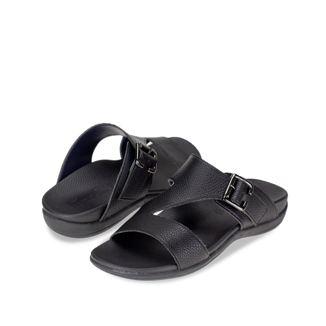 Full view of comfortable men's black leather sandals with orthotic arch support footbed, featuring a special zig-zag design with buckle by Thomas Chan