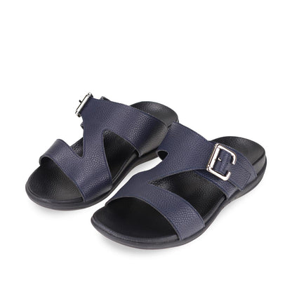 Diagonal view of comfortable men's navy blue leather sandals with orthotic arch support footbed, featuring a special zig-zag design with buckle by Thomas Chan