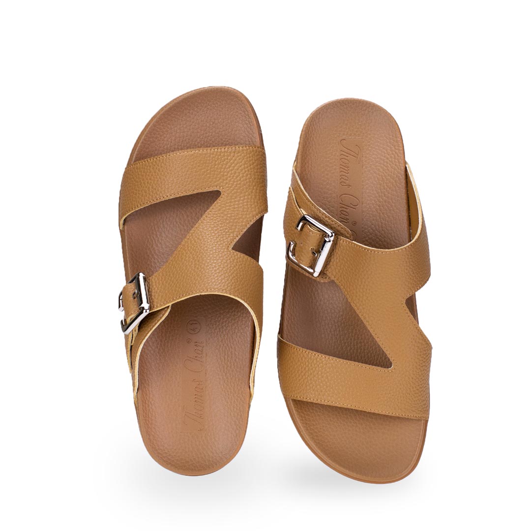 Front view of comfortable men's light brown leather sandals with orthotic arch support footbed, featuring a special zig-zag design with buckle by Thomas Chan