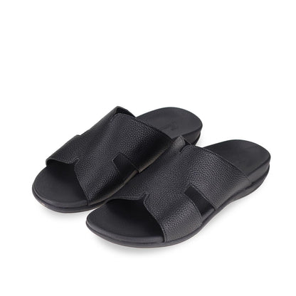 Diagonal view of black comfortable men's leather H-strap sandals with arch-supporting footbed