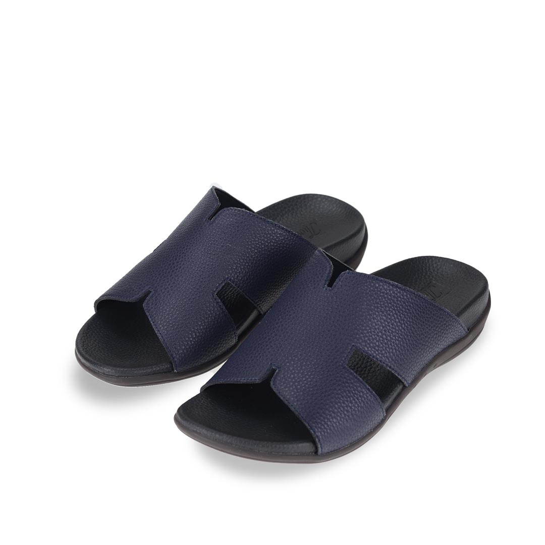 Diagonal view of navy blue comfortable men's leather H-strap sandals with arch-supporting footbed