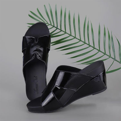 Simple classic Thomas Chan black patent glossy ultra comfortable H strap design wedge slide sandals in grey backdrop