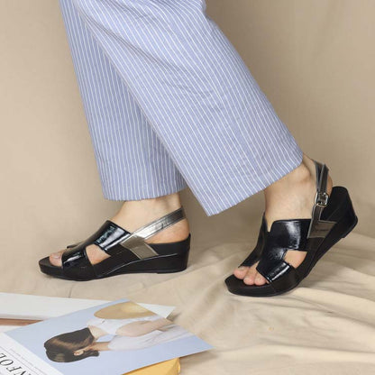 Colour match black and silver casual wedge sandals matches with simple light blue ankle pants