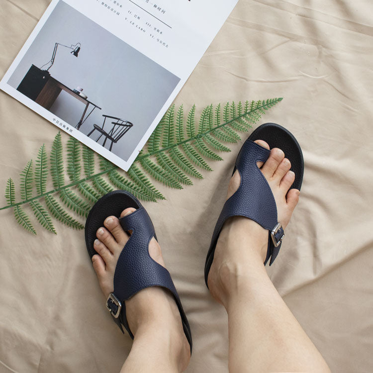 Navy blue ladies sandals with comfortable toe loop design and soft leather slip-on shoes